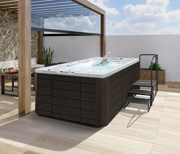 Hot Tubs, Spas, Portable Spas, Swim Spas for Sale Hot Tubs, Spas, Portable Spas, Swim Spas for Sale Calspas hot tub being used in a family setting